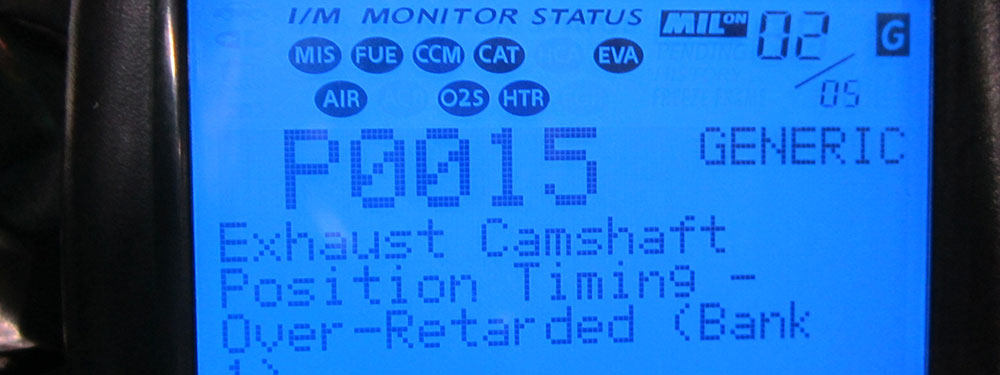 A scan tool display reading fault code P0015, exhaust camshaft position timing over-retarded, bank 1.